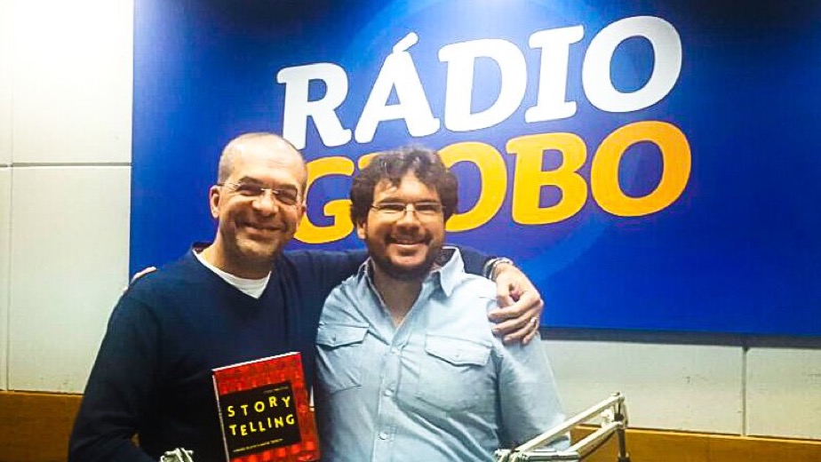 At the radio studio with the Storytelling book